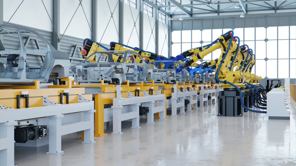 Robôs industriais amarelos em linha de montagem